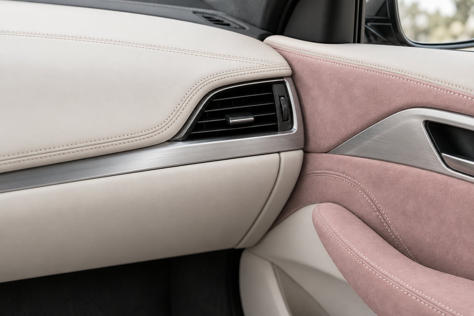 an ivory leather dashboard with rose Alcantara detailing