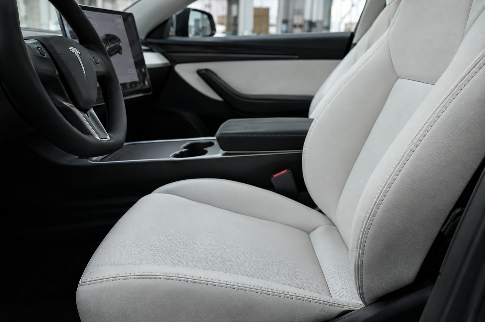 White electric-car upholstery: Material texture · Motenza, Hollywood FL