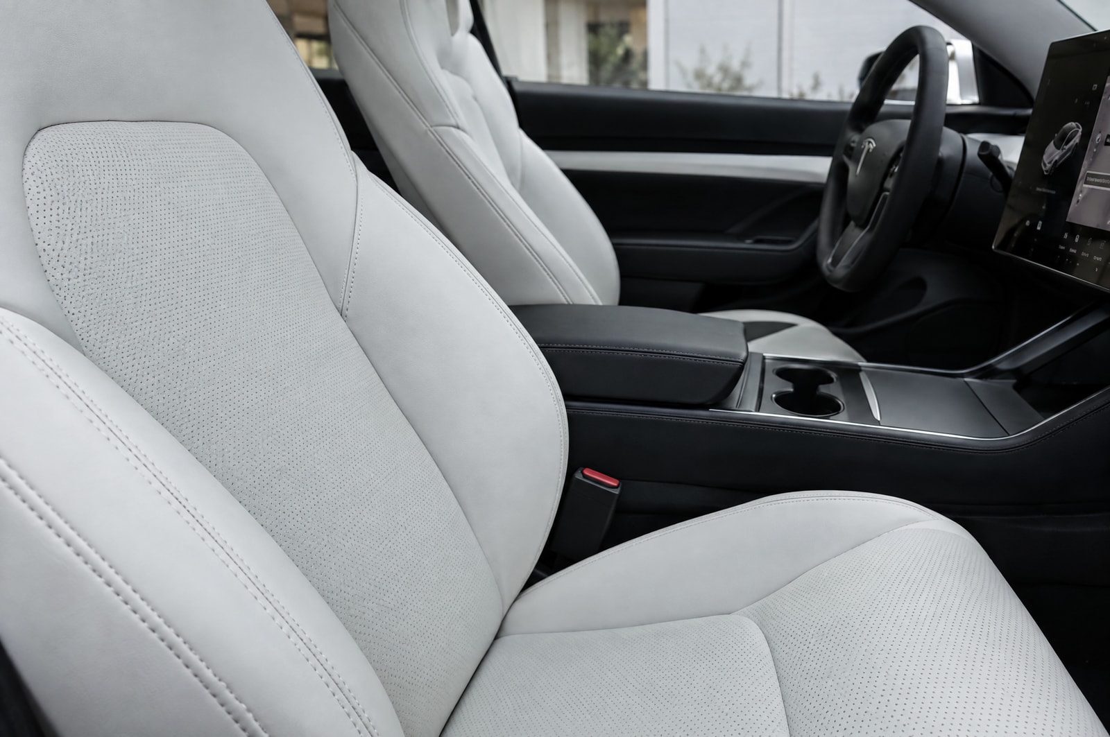White electric-car upholstery: Seam detail · Motenza, Hollywood FL