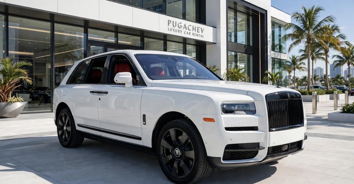 White Rolls-Royce Cullinan with red leather seats outside Pugachev Luxury Car Rental in Miami